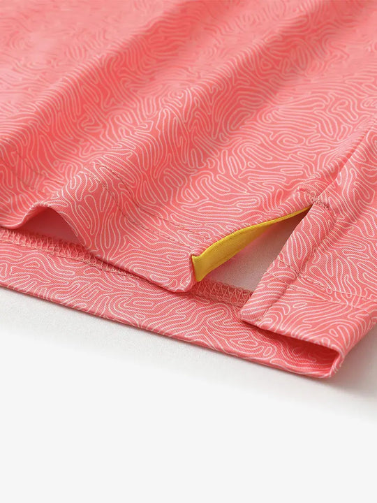 Hem slit detail of MAELREG Performance Jersey Print Polo in Candy Pink Line – comfort & movement