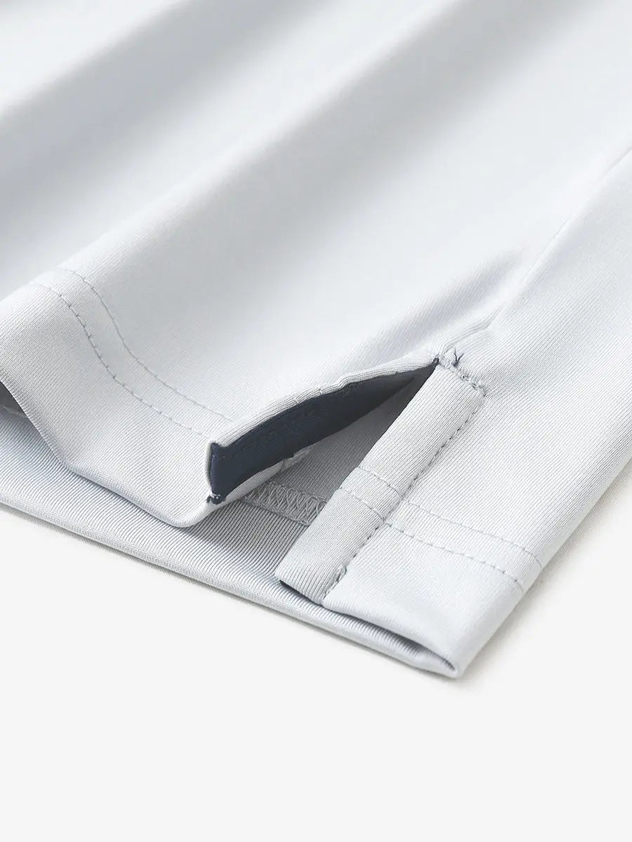 Close-up of hem slit detail in NAVYGLACIER GREY Premium Performance Polo