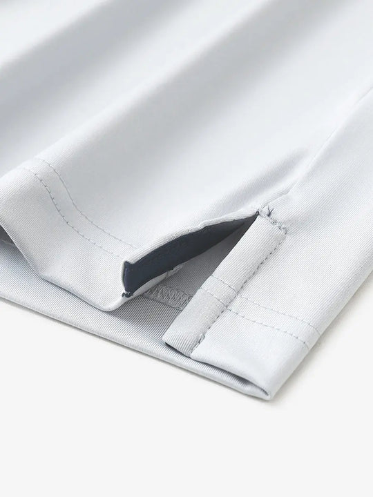 Close-up of hem slit detail in NAVYGLACIER GREY Premium Performance Polo